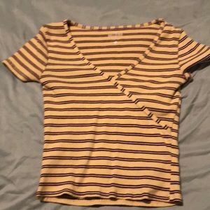 V neck beige shirt with red strips